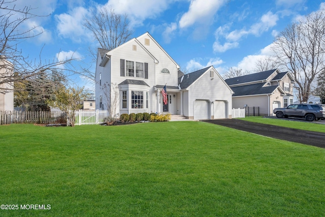 view of property with a front yard and a garage