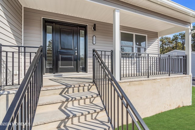 doorway to property with covered porch