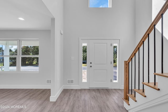 foyer entrance with light hardwood / wood-style floors