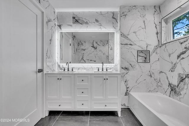 bathroom with a tub to relax in and vanity