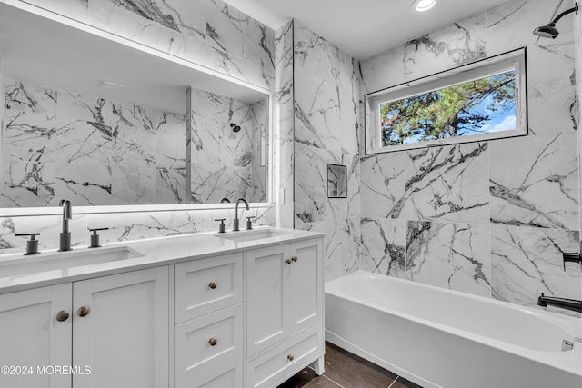 bathroom featuring shower / tub combination and vanity