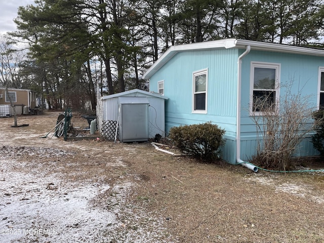 exterior space with a storage shed