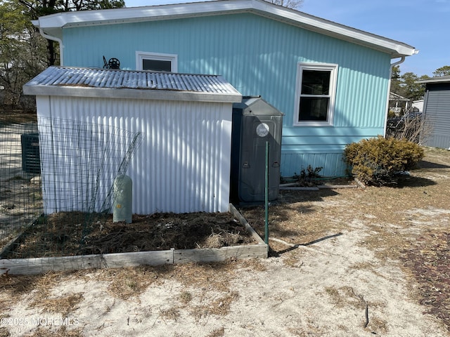 view of home's exterior featuring an outbuilding