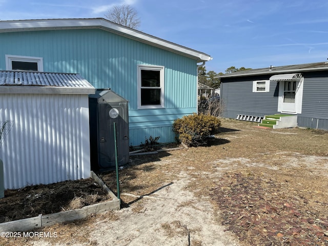 view of property exterior featuring entry steps