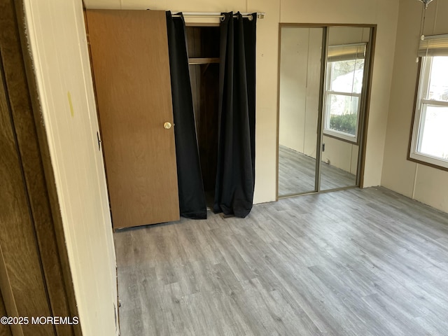 unfurnished bedroom with wood finished floors