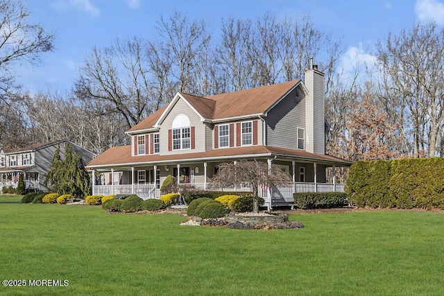 farmhouse inspired home with a front lawn and covered porch