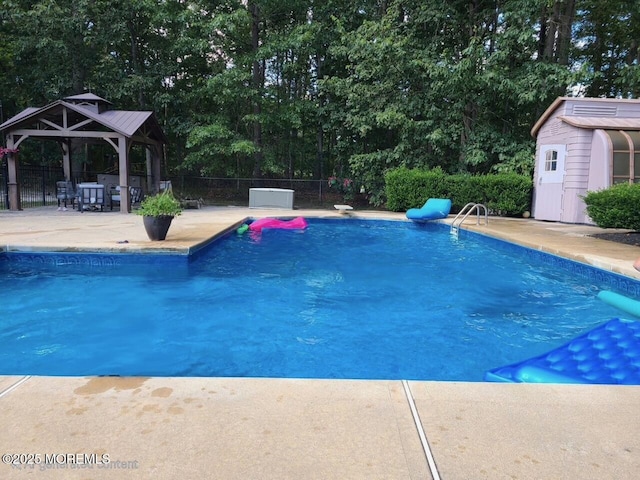 view of pool featuring a gazebo and a patio area