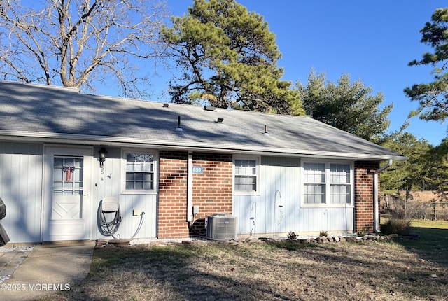 back of house featuring central AC