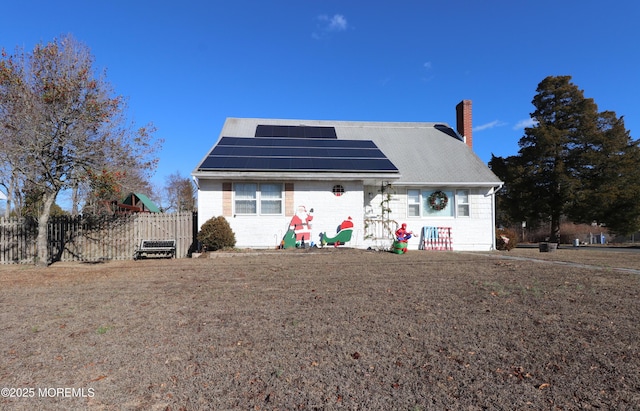 view of front of house with solar panels