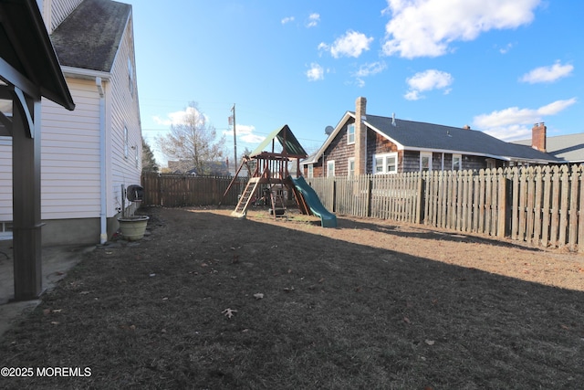 view of jungle gym featuring a fenced backyard