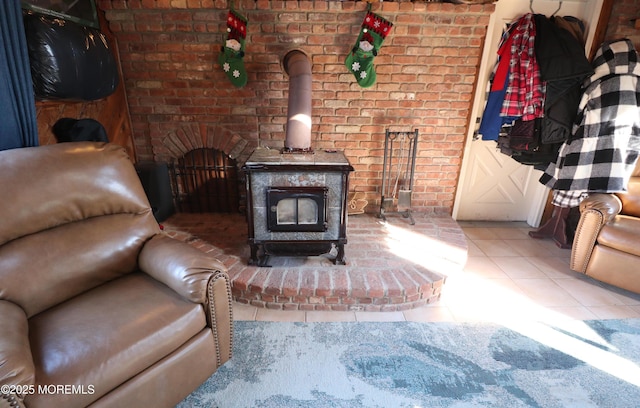 tiled living area featuring a wood stove