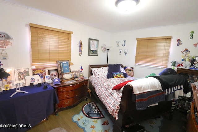 bedroom with wood finished floors