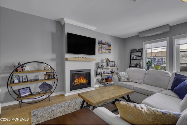 living room with hardwood / wood-style flooring and a wall unit AC