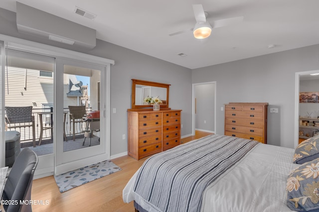 bedroom featuring access to outside, light hardwood / wood-style flooring, and ceiling fan