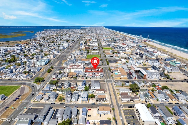 aerial view featuring a water view and a view of the beach