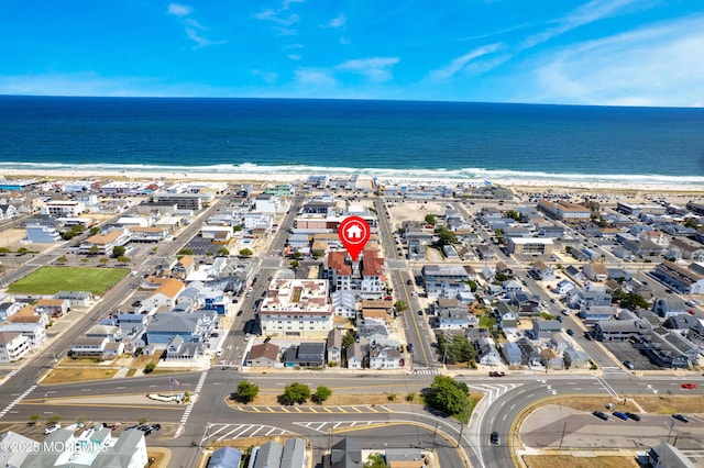 bird's eye view featuring a water view and a view of the beach