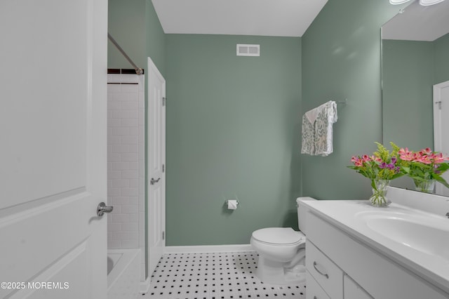 full bathroom featuring vanity, toilet, and tiled shower / bath