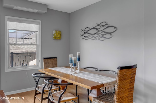 dining space featuring light hardwood / wood-style floors