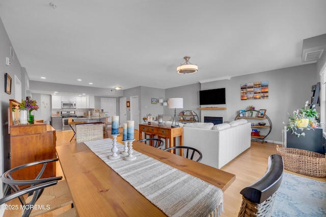 dining room with light hardwood / wood-style floors