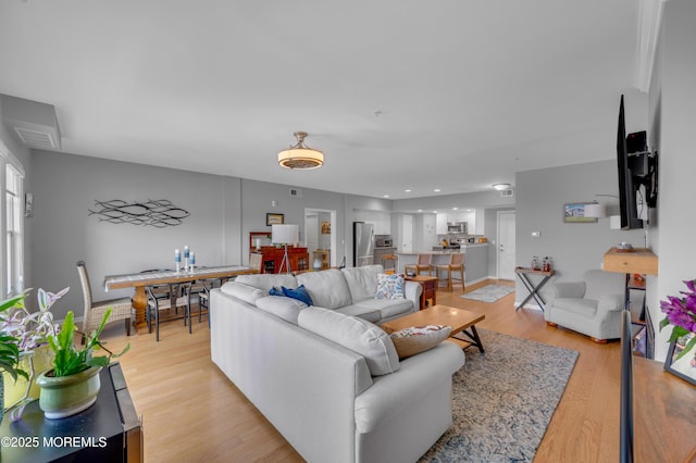 living room with light hardwood / wood-style flooring