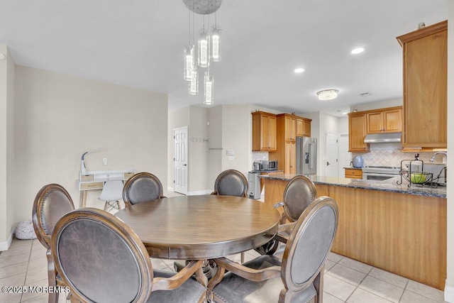 dining space with light tile patterned floors