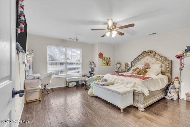 bedroom featuring hardwood / wood-style flooring and ceiling fan