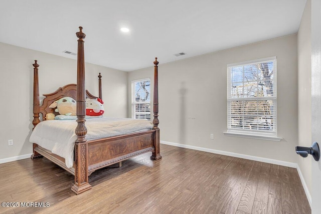 bedroom with hardwood / wood-style floors