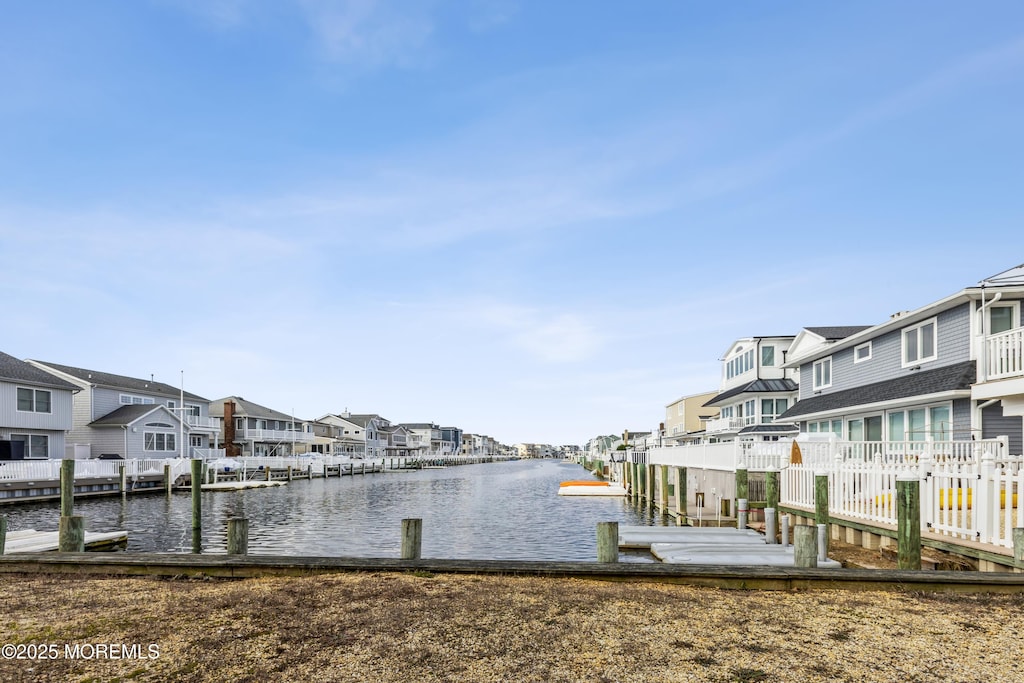 dock area with a water view