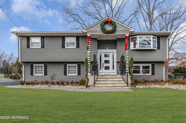 bi-level home with a front yard