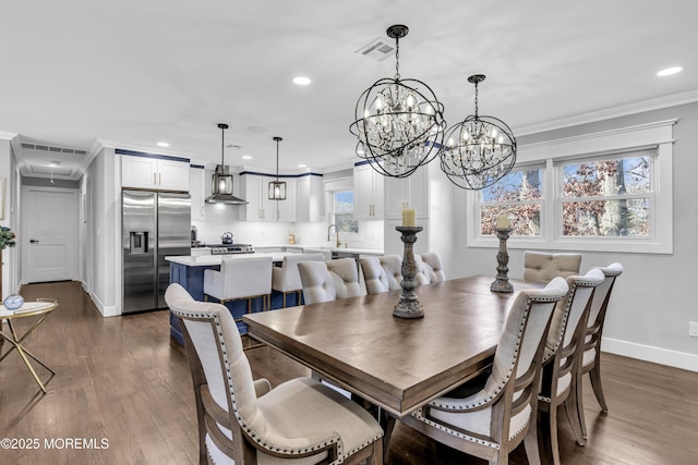 dining room with visible vents, crown molding, baseboards, and dark wood-style flooring