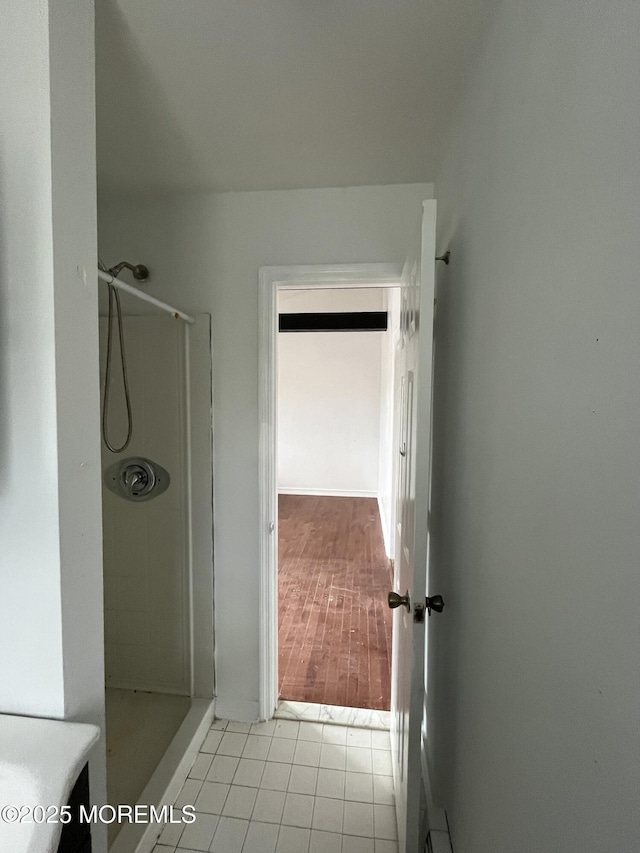 bathroom featuring a shower and tile patterned floors