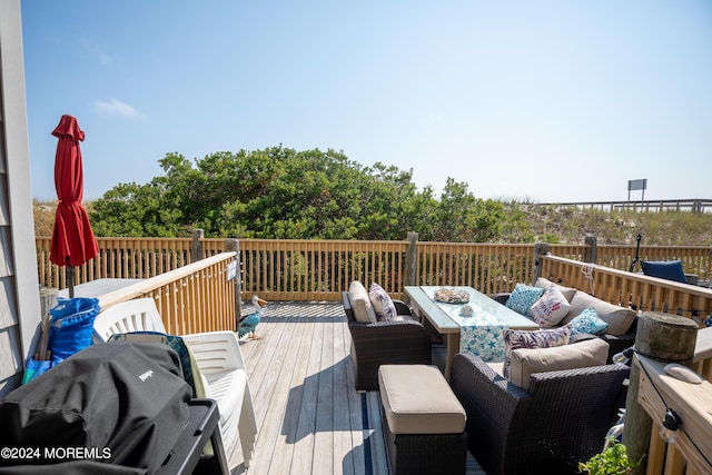 wooden deck featuring grilling area and outdoor lounge area