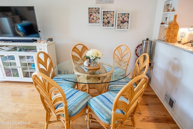 dining room with light hardwood / wood-style flooring