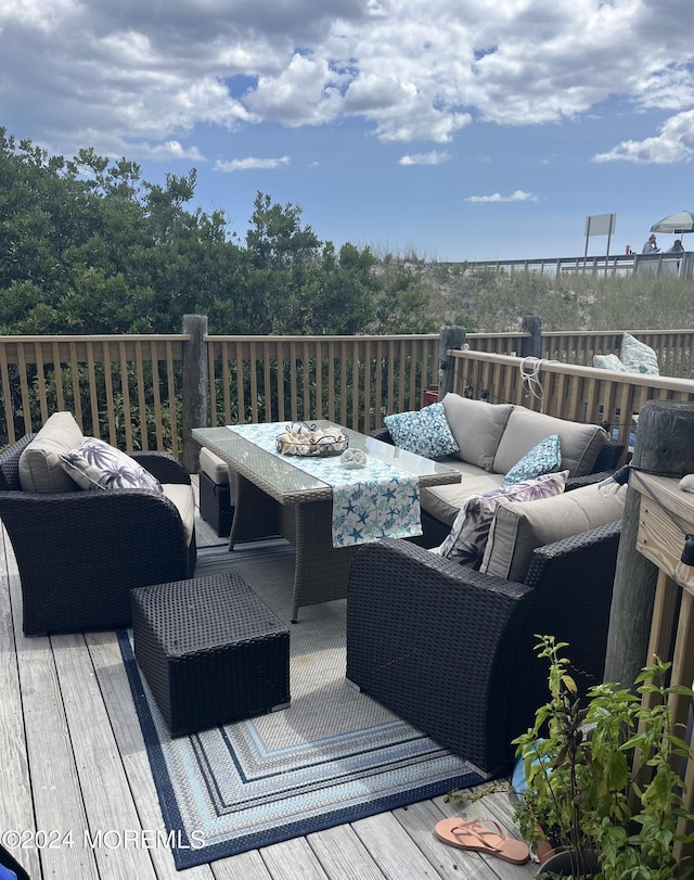 wooden deck with outdoor lounge area