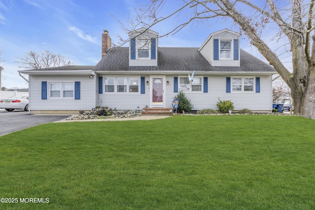 new england style home featuring a front yard