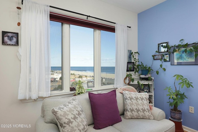 living area featuring a water view