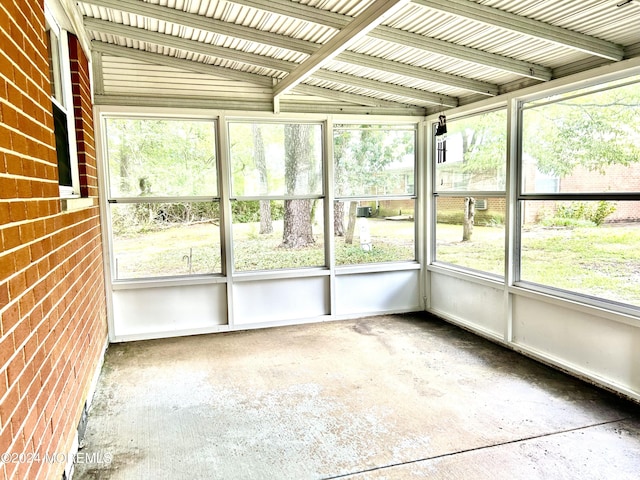 unfurnished sunroom with vaulted ceiling