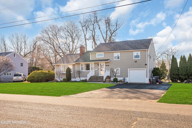 view of front of house featuring covered porch, a garage, and a front lawn