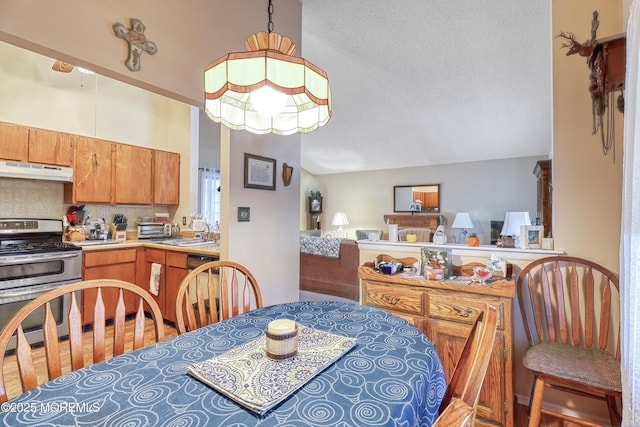 dining space with a textured ceiling