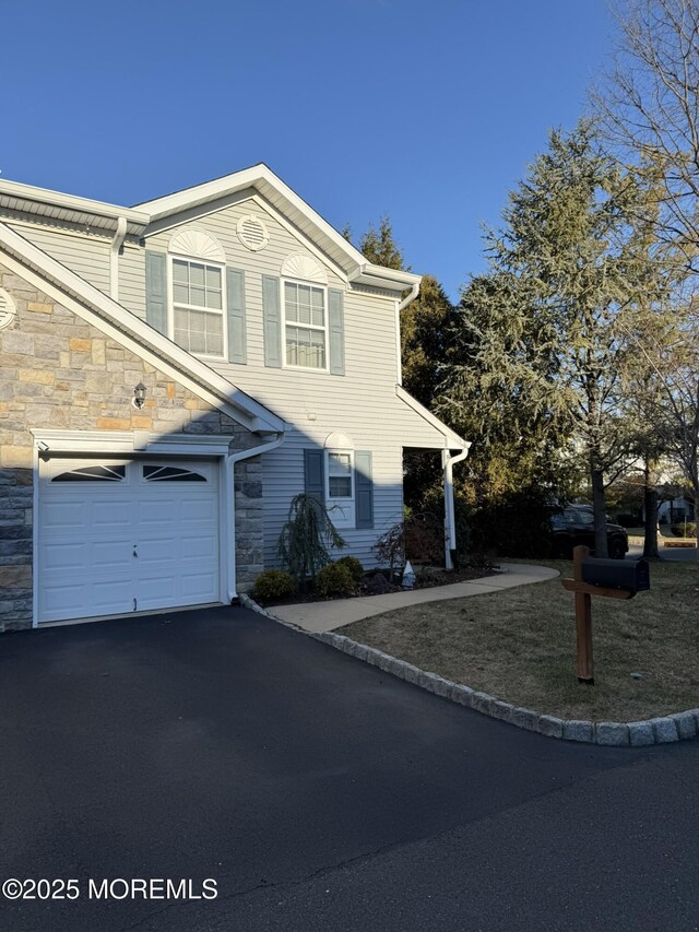 view of front of property with a garage