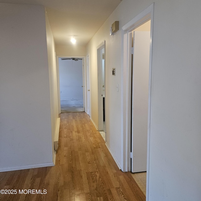 hallway featuring light hardwood / wood-style flooring