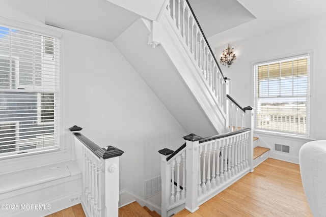 stairway featuring hardwood / wood-style flooring