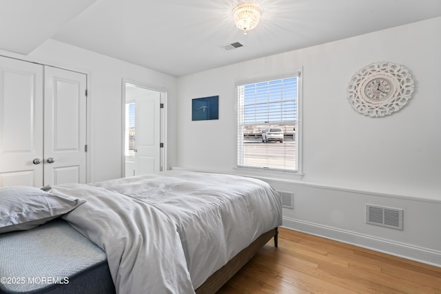 bedroom with hardwood / wood-style flooring