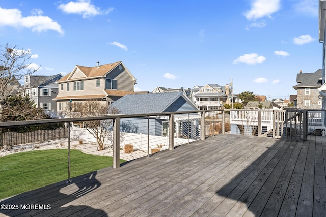 wooden deck with a lawn