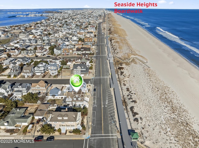 aerial view featuring a water view and a view of the beach