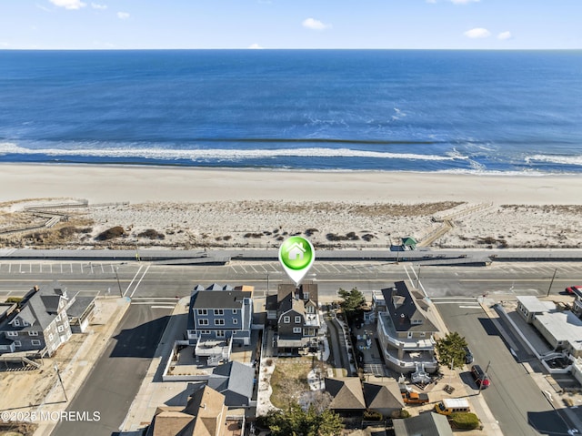 aerial view featuring a water view and a view of the beach