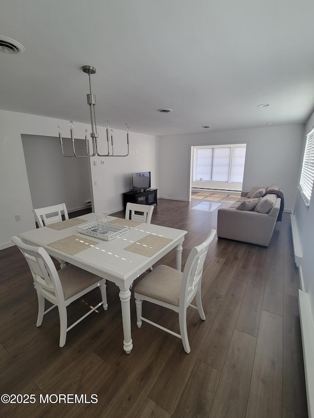 dining room featuring dark hardwood / wood-style flooring