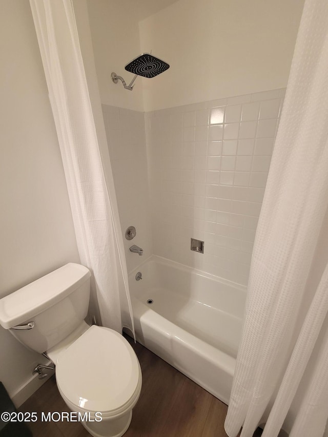 bathroom with shower / bath combo, toilet, and hardwood / wood-style flooring