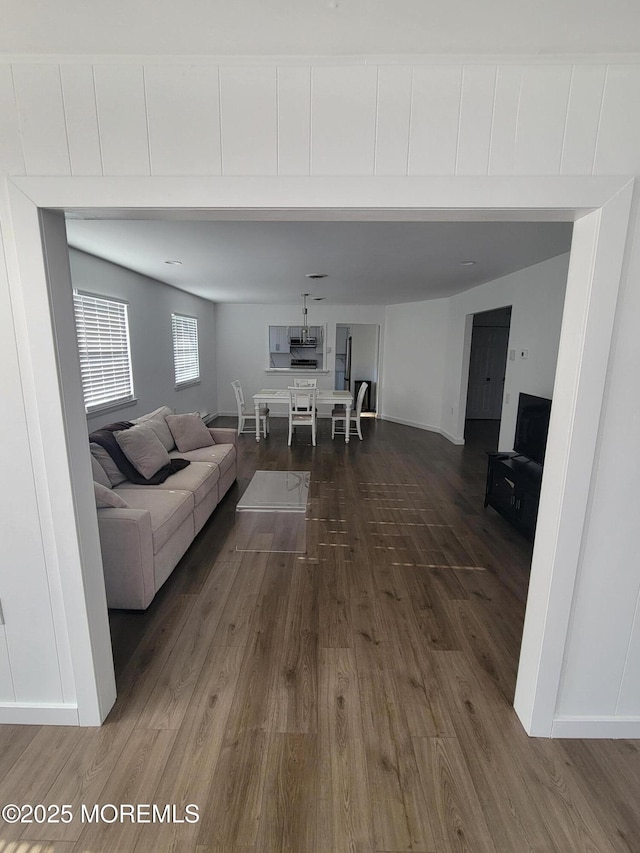 living room with dark hardwood / wood-style flooring