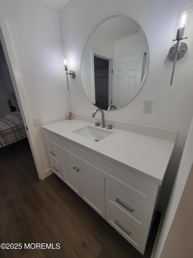 bathroom featuring hardwood / wood-style flooring and vanity